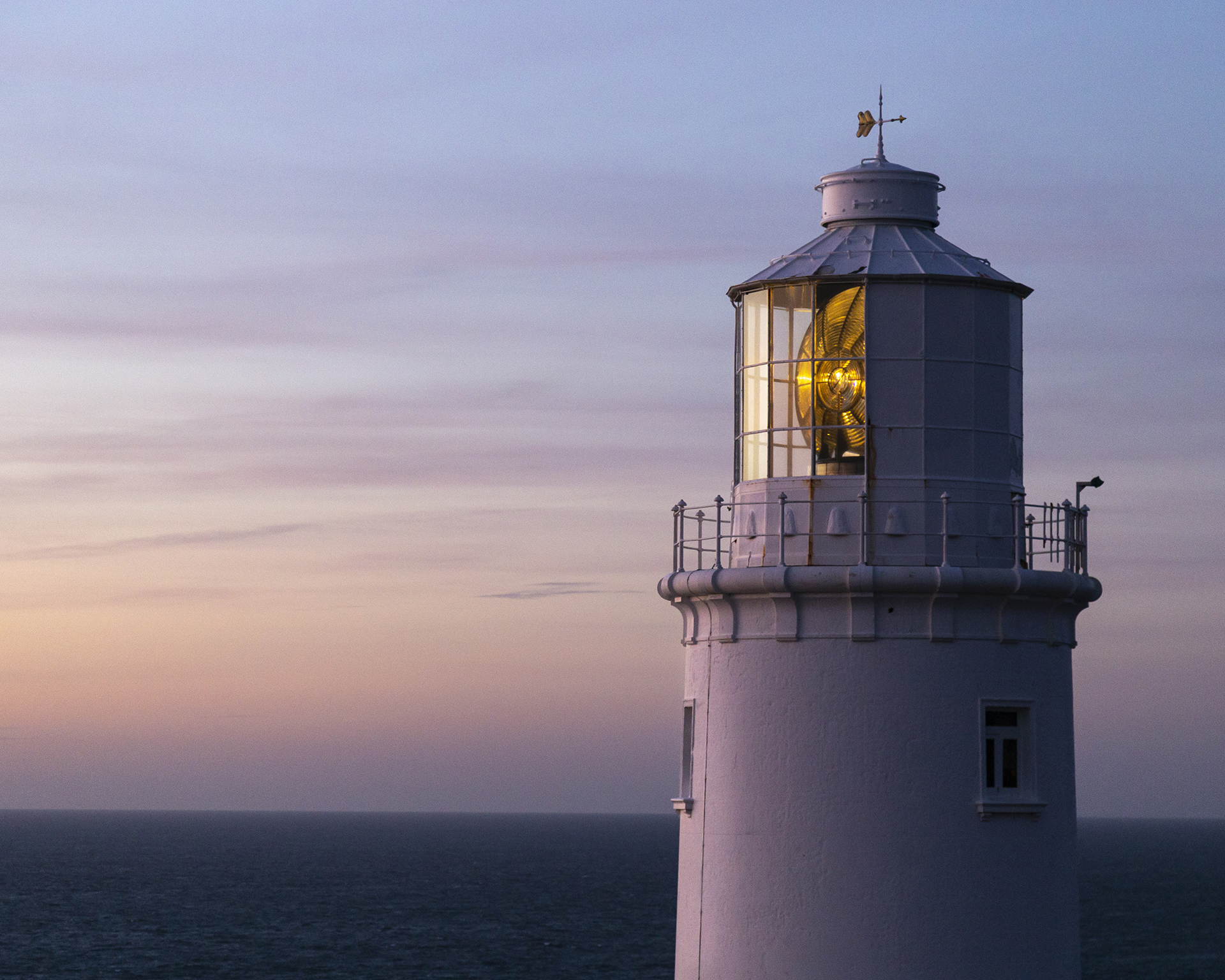 Top of a lighthouse on Trevose Head, Cornwall on a calm evening with light switched on