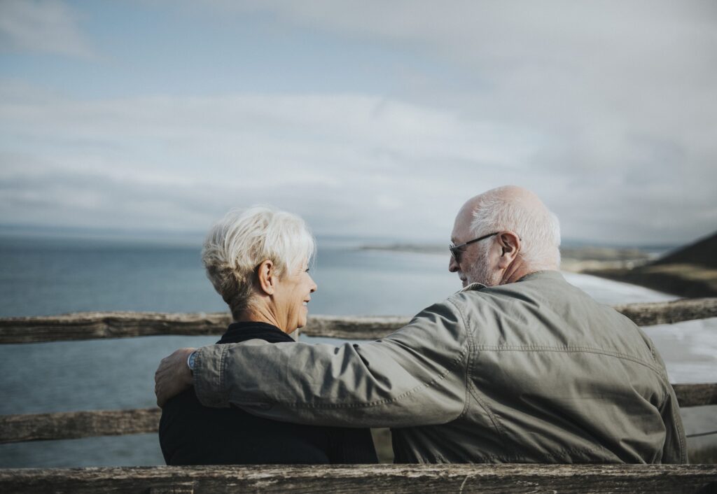 Senior couple enjoying the view of the ocean
